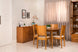 cadeira de madeira euro kit com 2 nozes e tecido bege claro em sala de jantar com buffet cristaleira e mesa de jantar euro