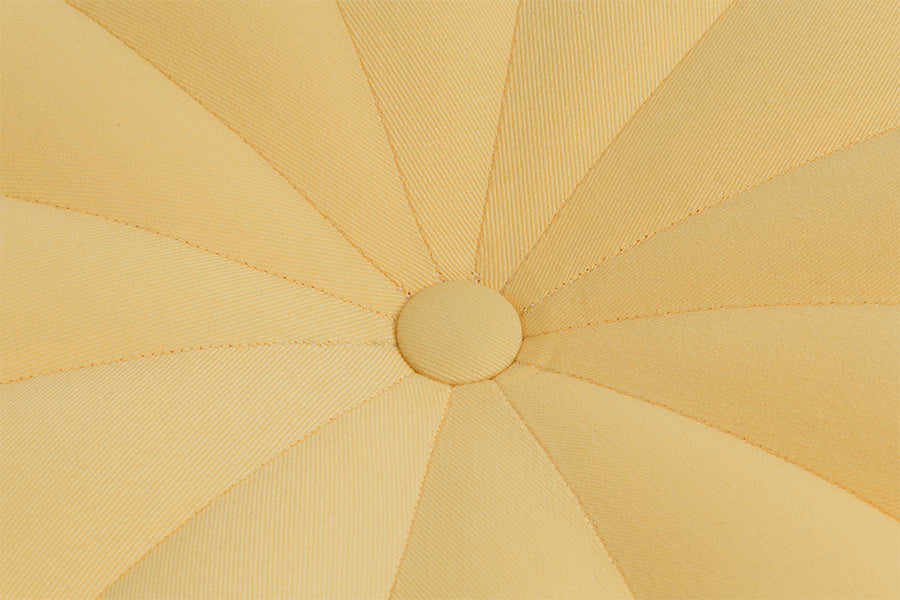 puff retro pitanga amarelo focando no meio do assento